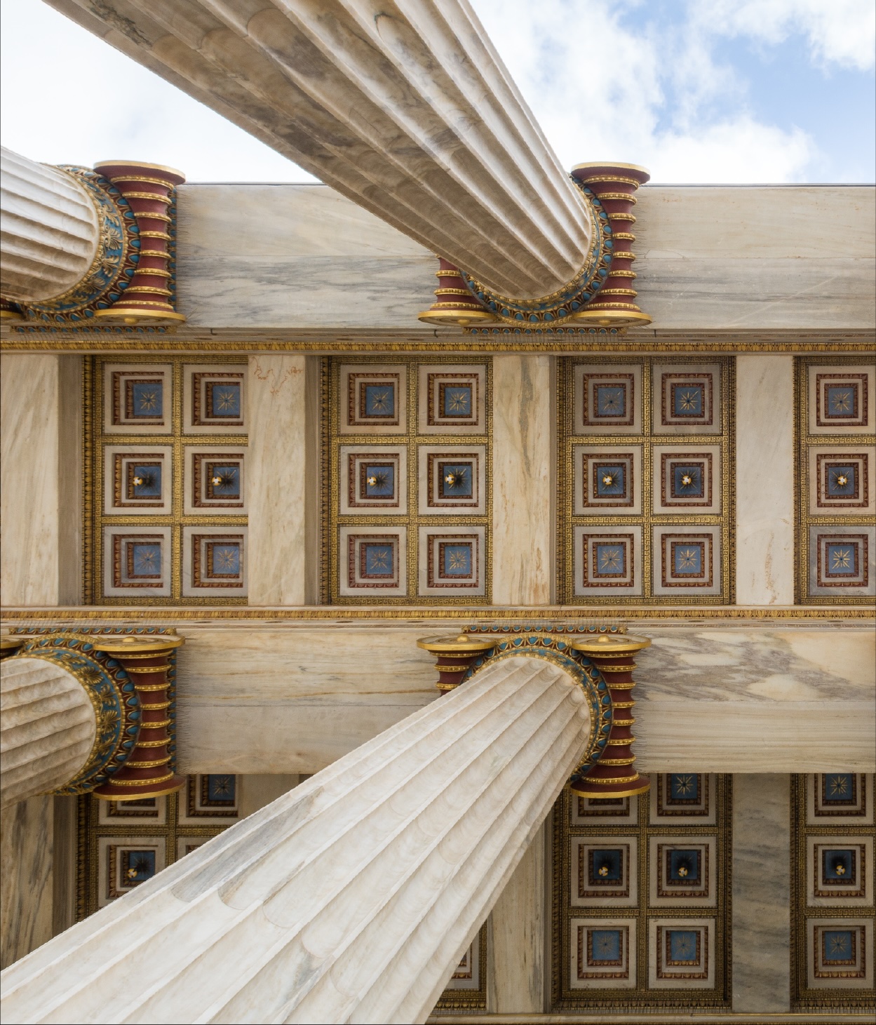 Photo of a statehouse's neoclassical roof with columns.