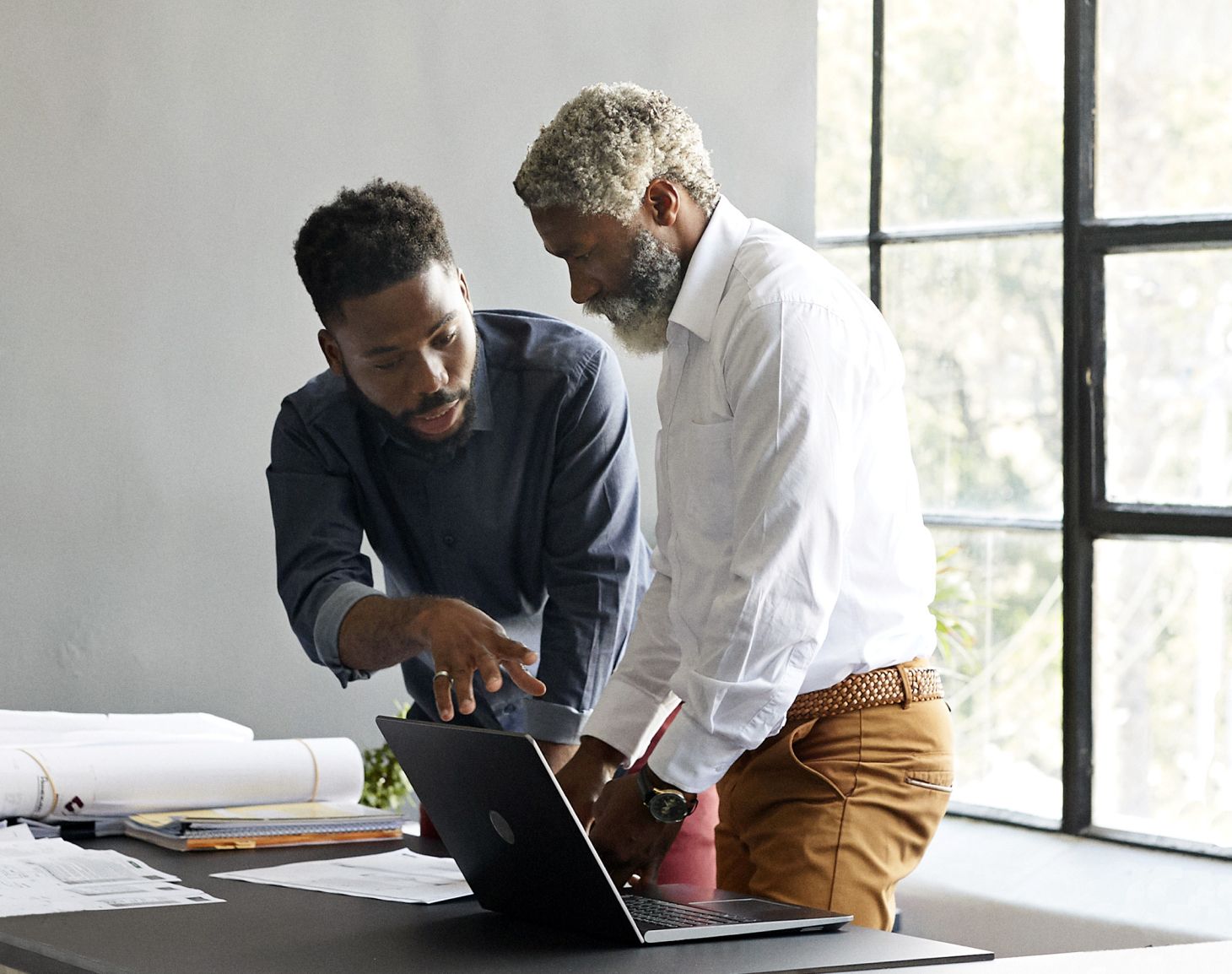 Close crop of two men discussing business